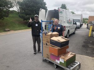 T2T Volunteer gives a thumbs-up at a food donor site