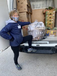 Nancy with charcoal donation