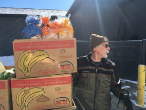 Steve Gallagher unloads food at CommUnity