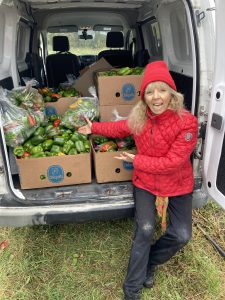 Nora with a van full of just-harvested produce