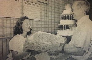 Frank Lalor receives baked goods from employee at Barbara's Bakery
