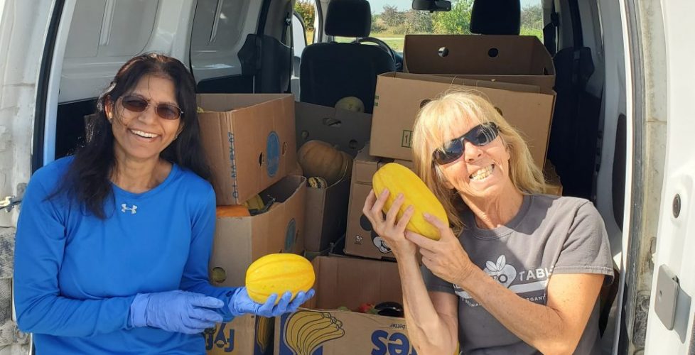 Rajni and Nora pose with freshly-harvested squash