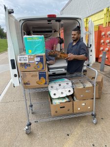 Volunteers unload a T2T van at CommUnity Food bank.