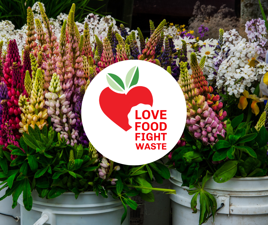 Farmers Market (3) Love Food Fight Waste logo over background of wildflowers