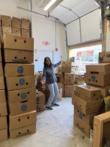 Rajni with many banana boxes.
