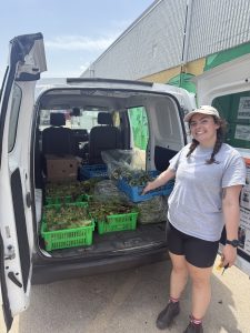 Natalie with a truckload of gleaned produce.