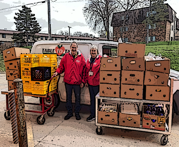 Will and Dedi with a day's worth of rescued food outside of T2T van.